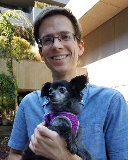 Arthur holding a cute dog